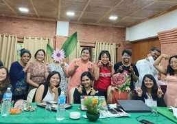 Group photo of digital storytelling workshop with participants looking at the camera and giving different poses